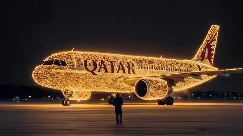 Qatar Airways aircraft adorned with sparkling Christmas lights 